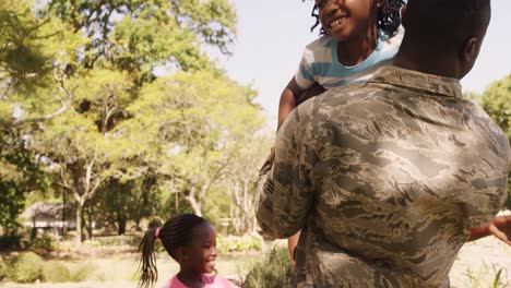 Exited-returning-soldier-man-meeting-his-wife-and-children