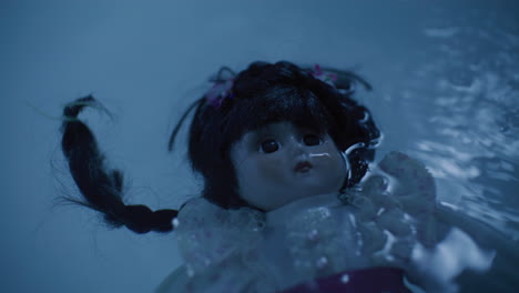 a porcelain doll floating in water