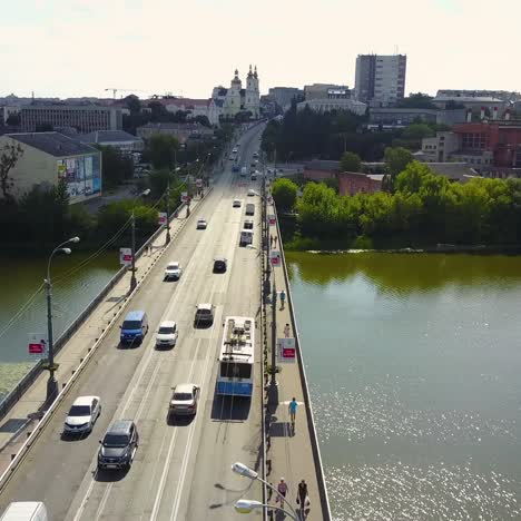 bridge road with automobile traffic. vinnitsa, ukraine - july 2017: aerial top view of bridge road automobile traffic of many cars, transportation concept