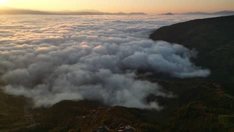 heavenly skies, awe-inspiring aerial footage of clouds dancing above majestic mountains at sunset (high-res footage)