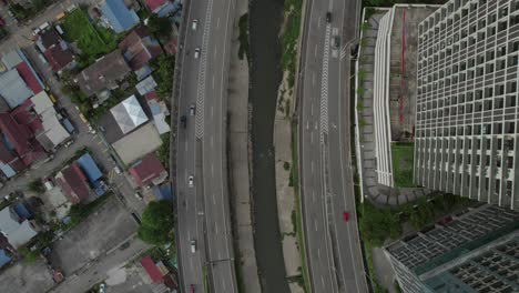 aerial view of city with river and highway