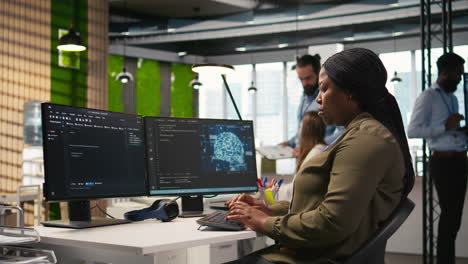 female technician writing code on pc, developing neural networks apis