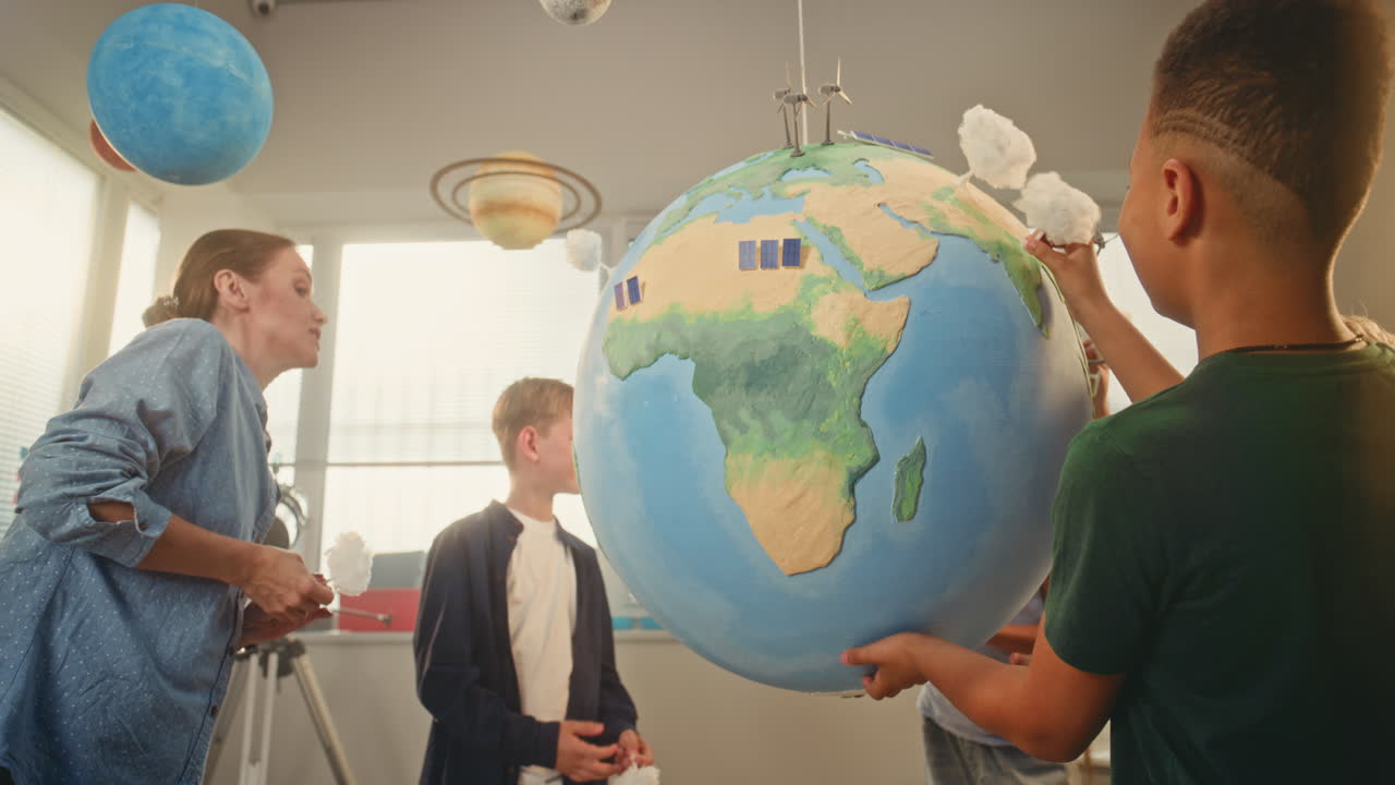 STEM Class on Renewable Energy Female Teacher Explaining Energy Resources to Elementary School
