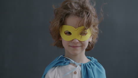 child dressed as superhero