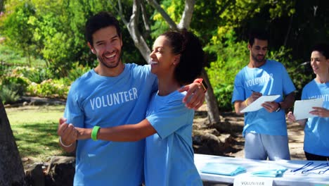 volunteers giving high five to each other 4k