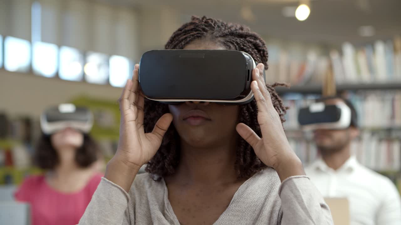 Slow motion shot of excited woman experiencing VR