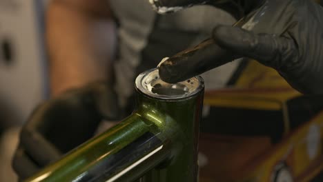 fresh grease is applied to a set of bearings in a bicycle headset