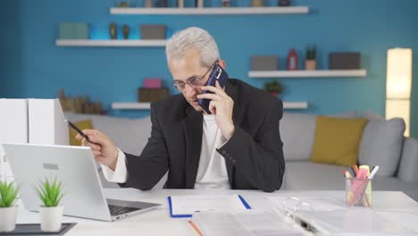 home office worker man speaks on the phone in managerial qualifications.