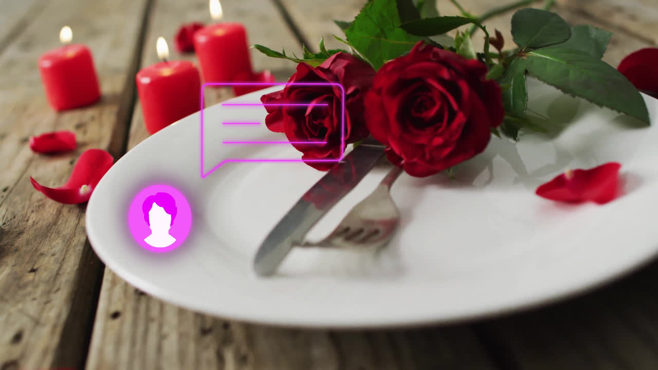 Digital chat icon overlaying red roses and candles on plate