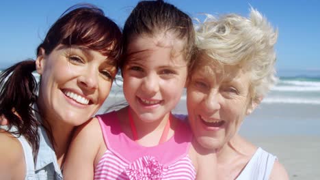 portrait of multi generation family at beach