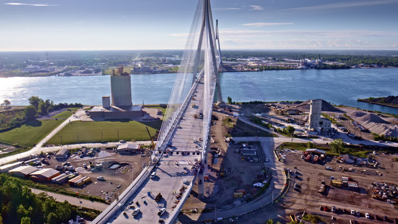 Drone orbit shot in cinematic tone capturing the link between the U.S. and Canadian sides