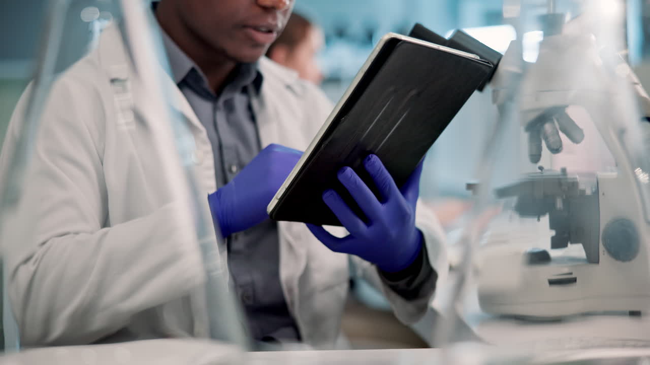 Scientist using tablet in lab