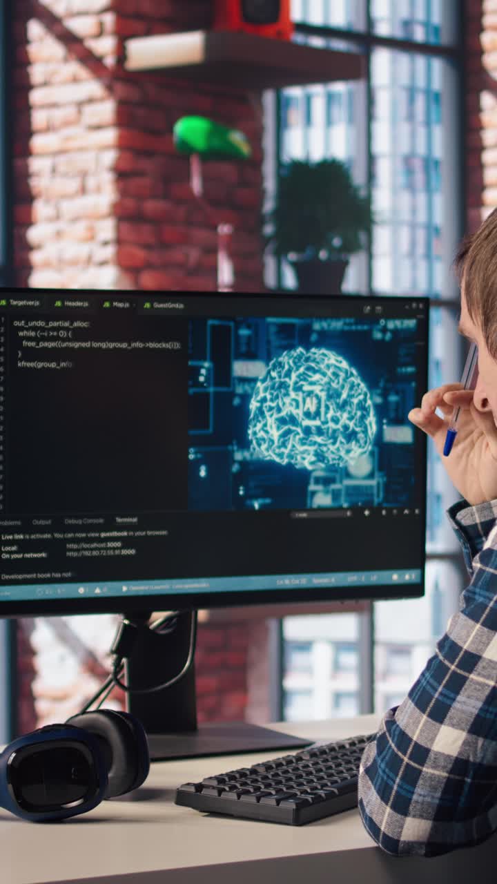 Vertical video Man works with AI deep neural networks, rubbing forehead with pen, feeling bored