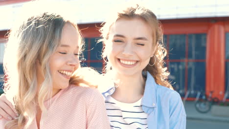 two women smiling outdoors