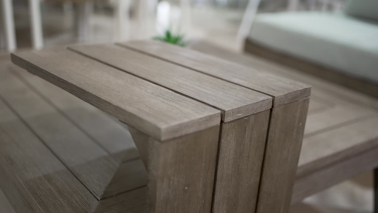 This clip highlights a stunning wooden coffee table in a modern living room. The craftsmanship and detail are evident in its smooth finish and practical design, perfect for any home