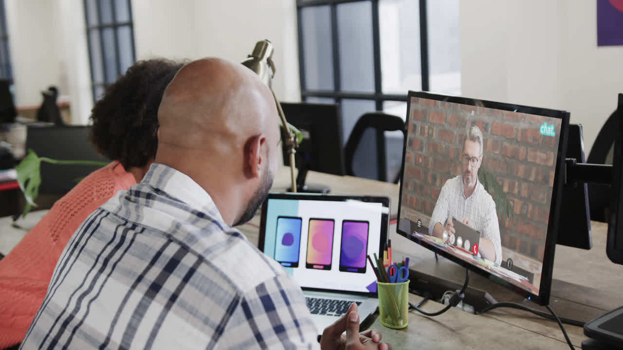 African american business people on video call with caucasian male colleague on screen