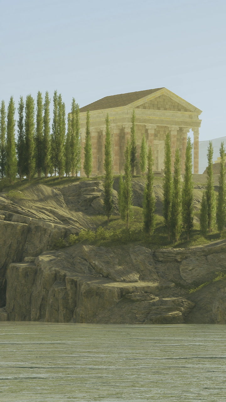 Ancient temple stands tall among lush greenery by serene waters