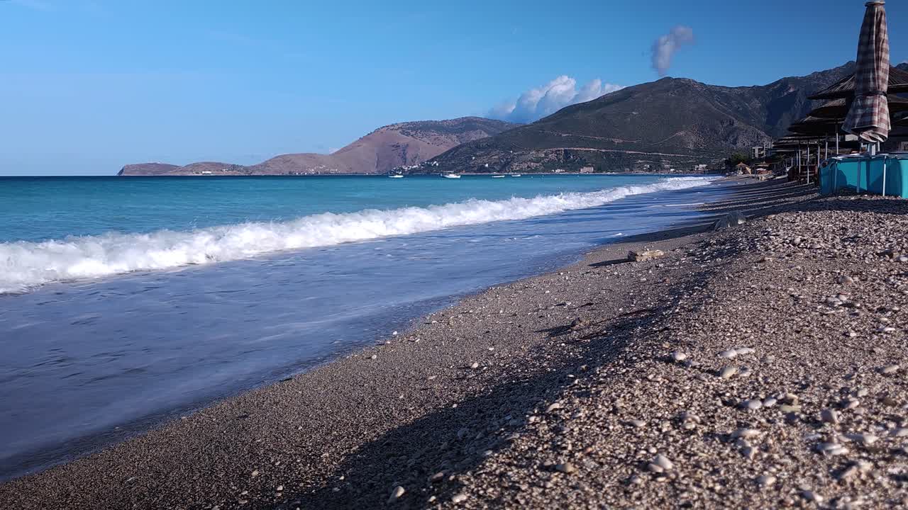 Morning Serenity on Empty Beach, Azure Mediterranean Sea, Sunrise, Umbrella on the Sandy Shore - A Tranquil Coastal Morning Scene