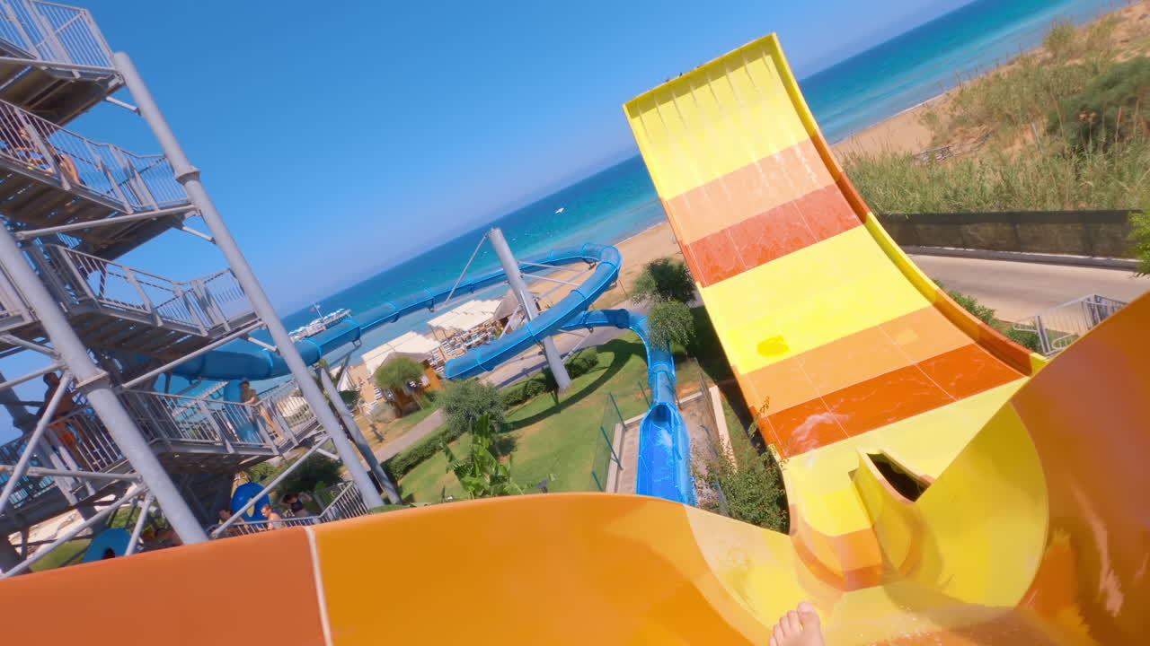 Woman sliding down a ride at a water park