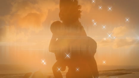 shining star icons against over african american man giving his wife a piggyback ride at the beach