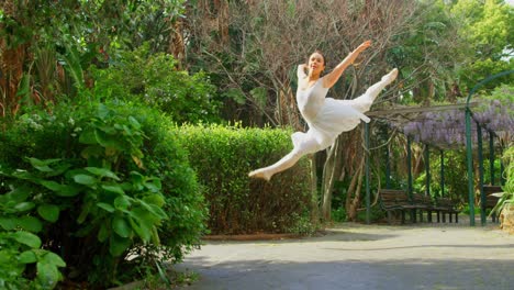 young ballerina dancing in the park 4k