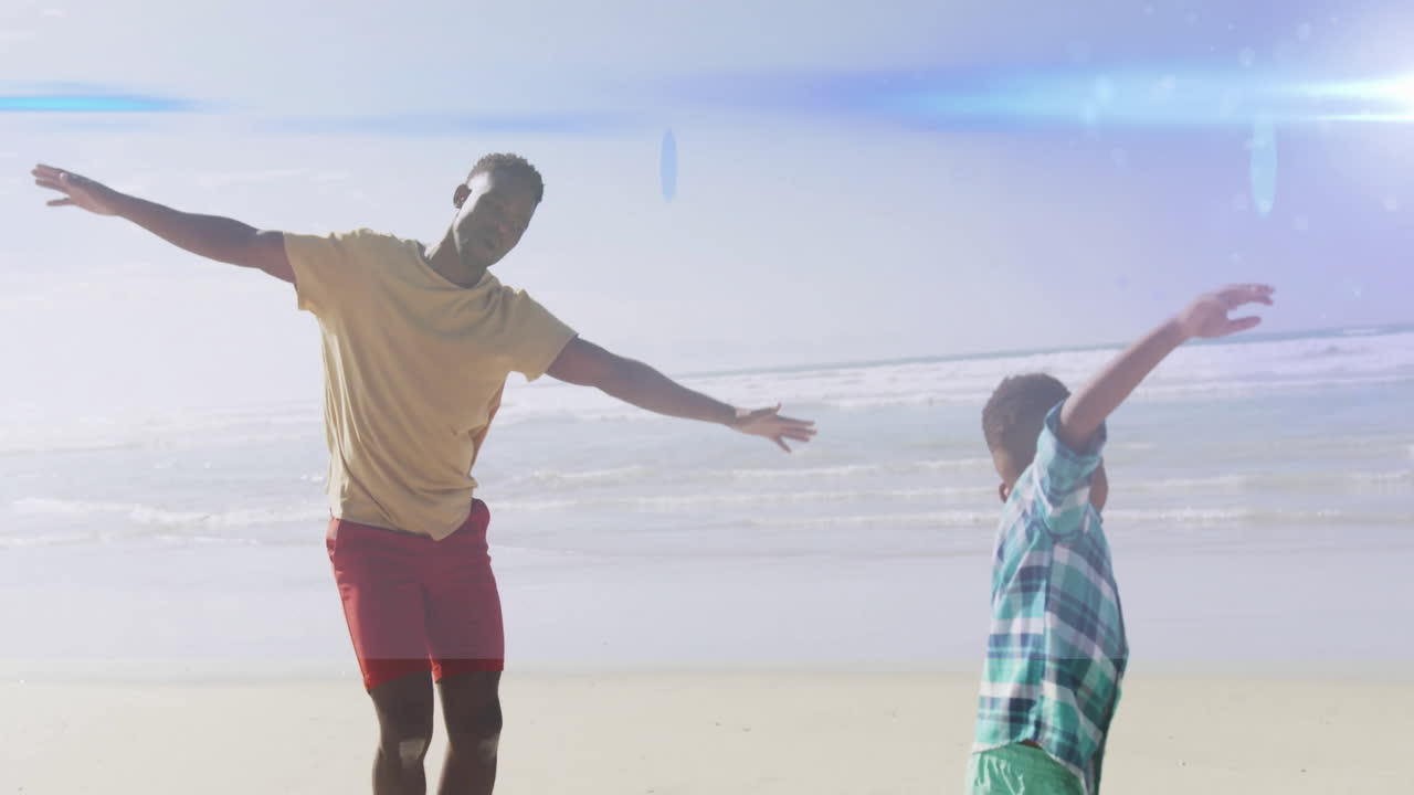Playing joyfully, father and child on sunny beach creating animation memories