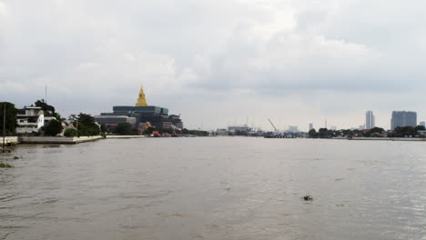 new thai parliament building by the chao phraya river in bangkok with a magnificent golden buddha statue hall for house of representatives sessions