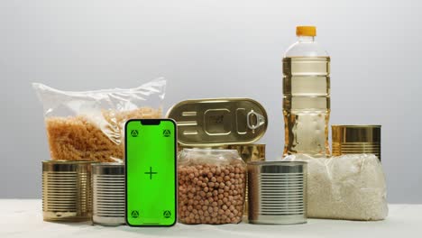 canned cereals beans fish and vegetables, an assortment of processed foods, supermarket cart online shopping, delivery.