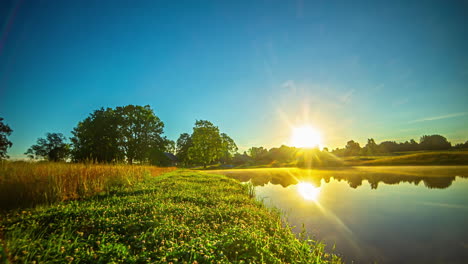 Time-lapse-of-a-beautiful-lake-with-a-villager-house-and-grassland-nearby