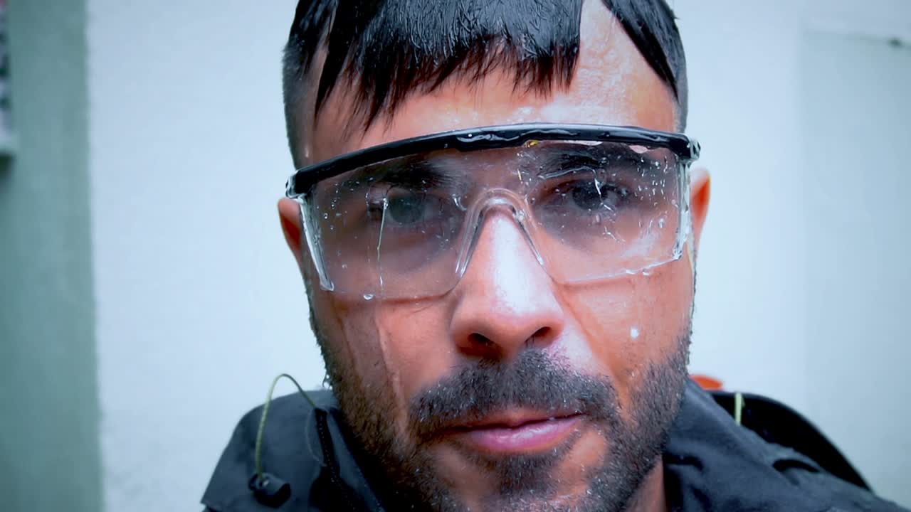 Water is dripping on a firefighter face