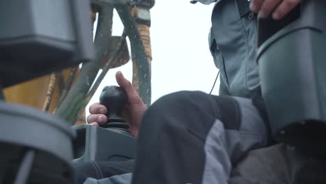 excavator operator controlling machine