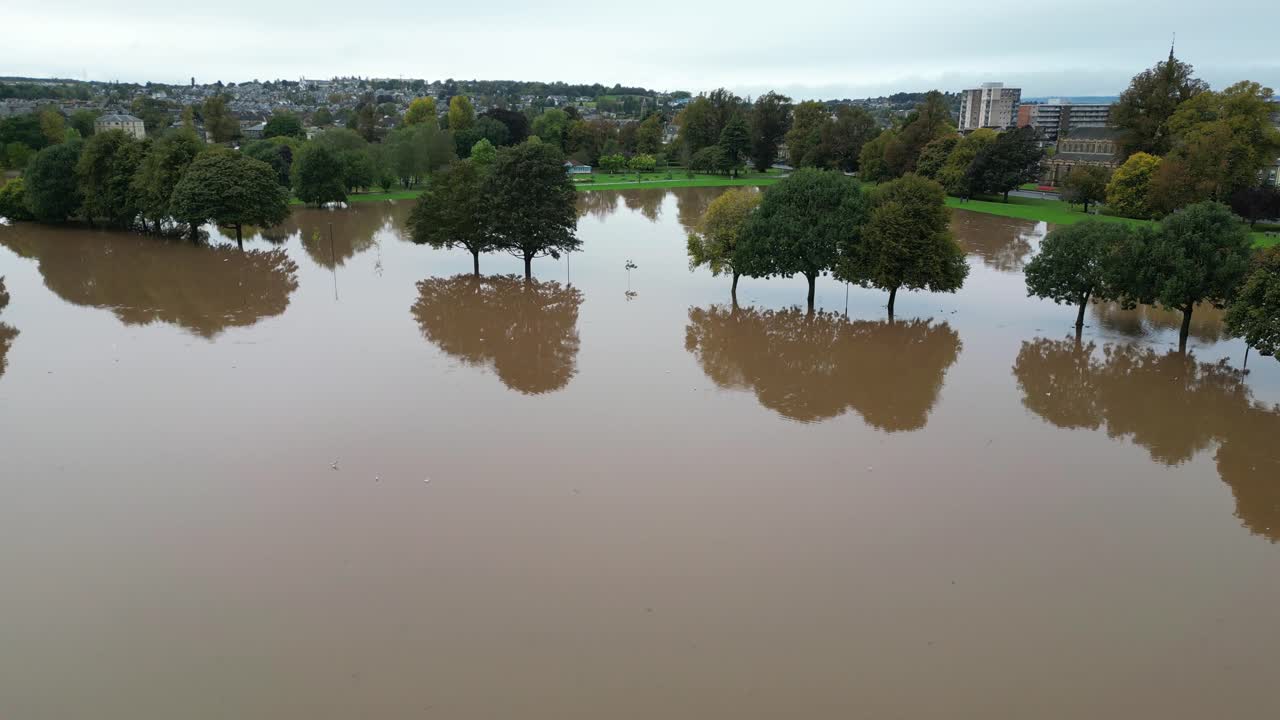 Aerial revealing shot of flooded South Inch Park in Perth and Kinross