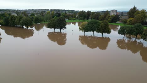 Aerial-revealing-shot-of-flooded-South-Inch-Park-in-Perth-and-Kinross