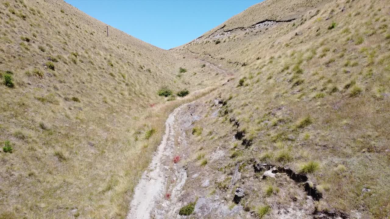 drone flying up the valley