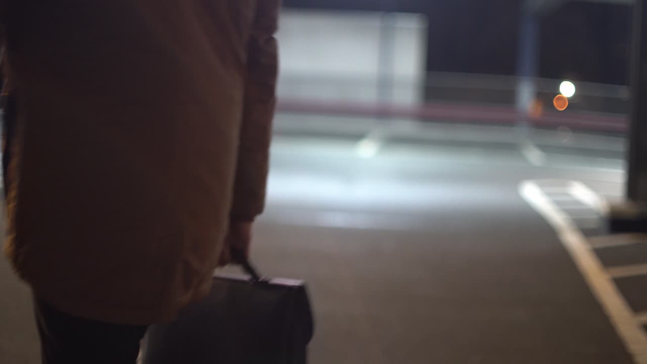 Businessman is standing on multi-storey car park after his work - 2 - LOG Footage