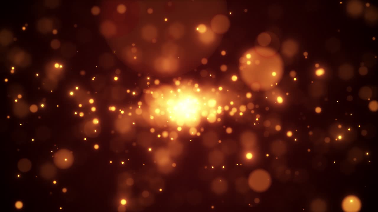 Abstraktit kultaiset bokeh-hiukkaset leijuvat ja kimaltelevat