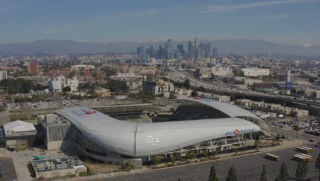 wonderful aerial bmo soccer stadium in los angeles with snowy mountains