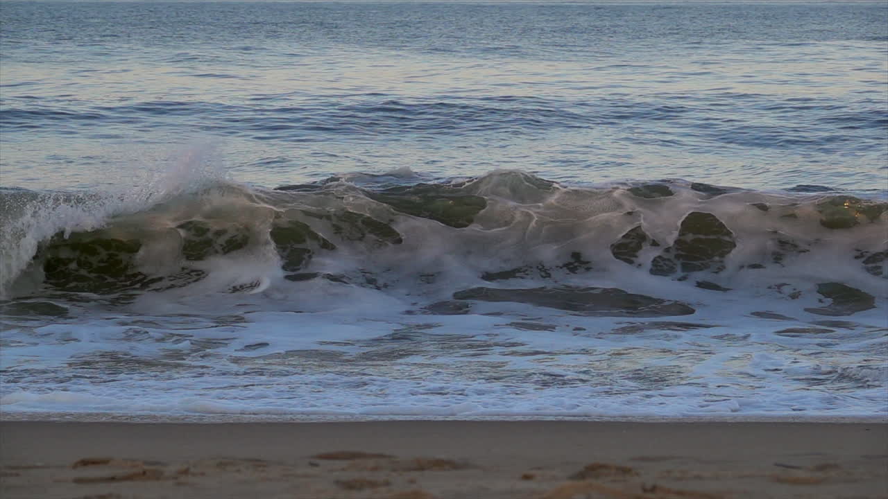 Waves break in slow motion
