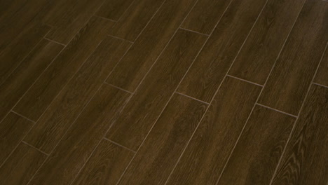 dark brown flooring tiles made of ceramic or porcelain or wood material