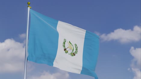 Flag-Of-Guatemala-Moving-In-The-Wind-With-A-Clear-Blue-Sky-In-The-Background,-Clouds-Slowly-Moving,-Flagpole,-Slow-Motion
