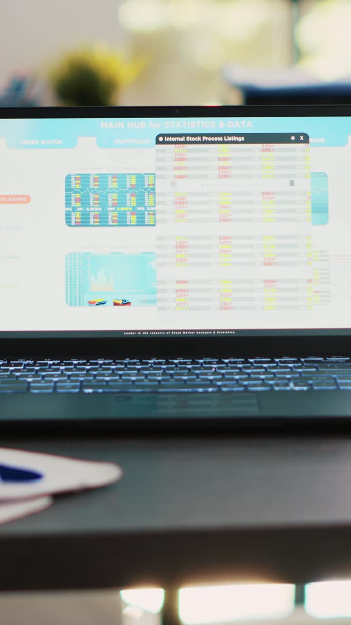 Vertical video Stock market diagrams with charts and stock figures on laptop sitting on desk