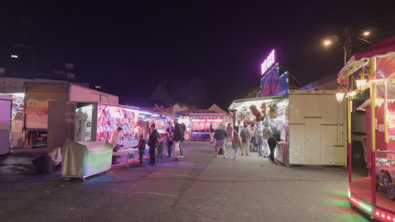 Night Market Funfair with Colorful Lights and People