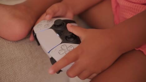 child playing with a playstation 5 controller