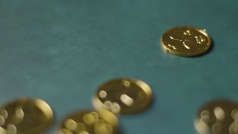 close up studio shot of gold coins with shamrock symbol on background to celebrate st patricks day 2