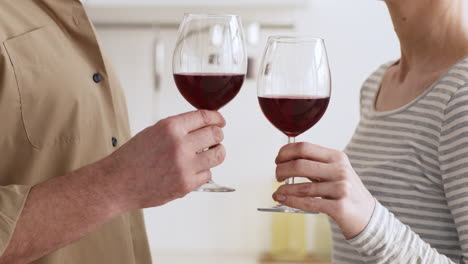 couple toasting with wine glasses