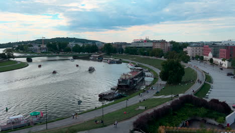 Tourists-walk-on-the-Vistula-Boulevard-in-Krakow-near-the-Wawel-Royal-Castle