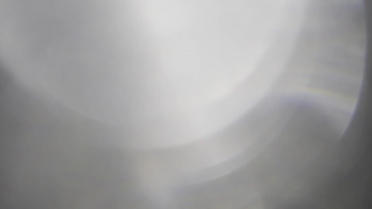 Elegant white prism light leak overlay with brilliant crystal refractions and subtle lens flares