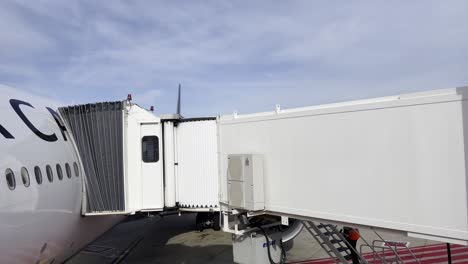 airplane boarding through jet bridge at airport