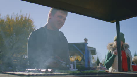 adult man learning to cook at master class adult man in apron learning to cook at cooking master class