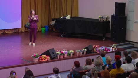 woman giving a presentation to an audience